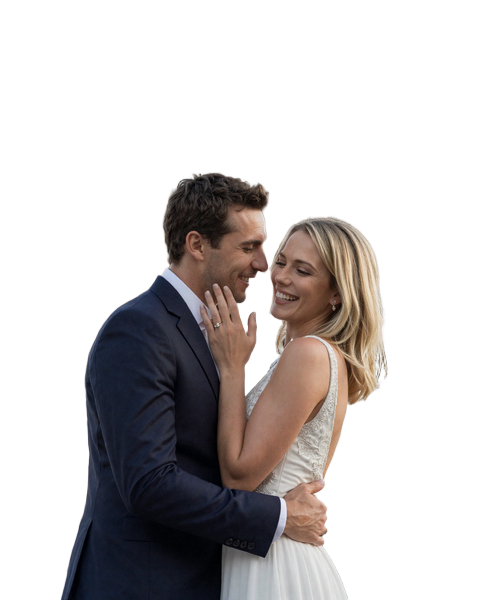 Happy American-French engaged couple embracing in Paris with Eiffel Tower background showing authentic joy