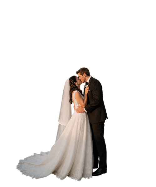 American-Italian couple kissing at romantic Tuscan villa wedding with Mediterranean architecture