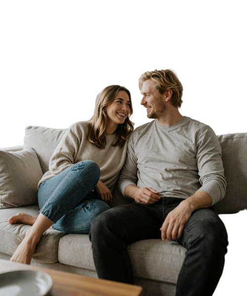 American-Swedish couple in comfortable intimate moment at minimalist Scandinavian home showing authentic connection