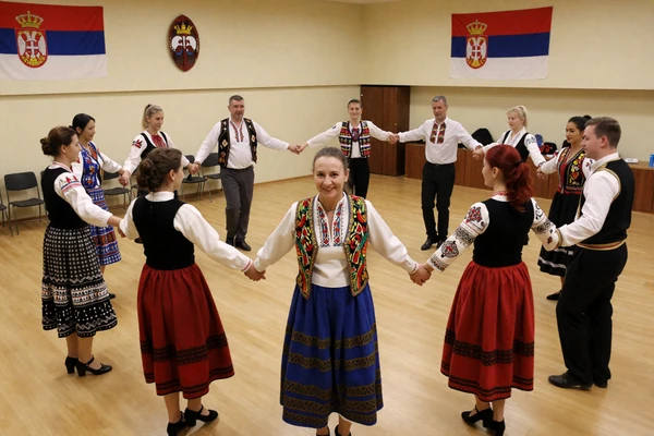 Kolo dance workshop with participants in traditional costumes
